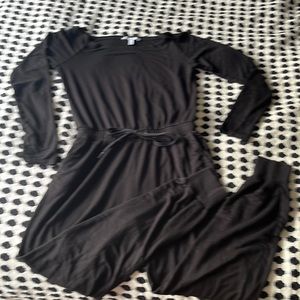 Express X Olivia Culpo black jumpsuit with boatneck to wear off the shoulder